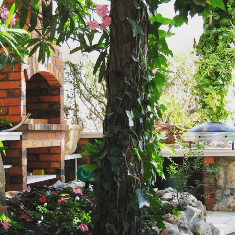 Stone outdoor barbecue in a garden