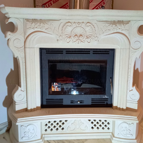 Ornate hand-carved stone fireplace mantel