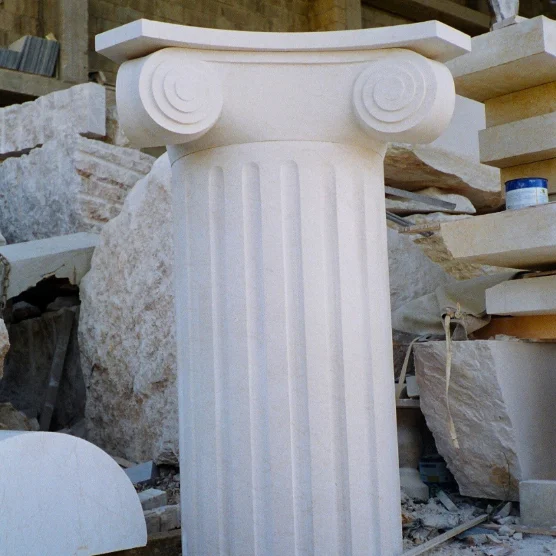 Fluted stone column with an Ionic capital in the workshop